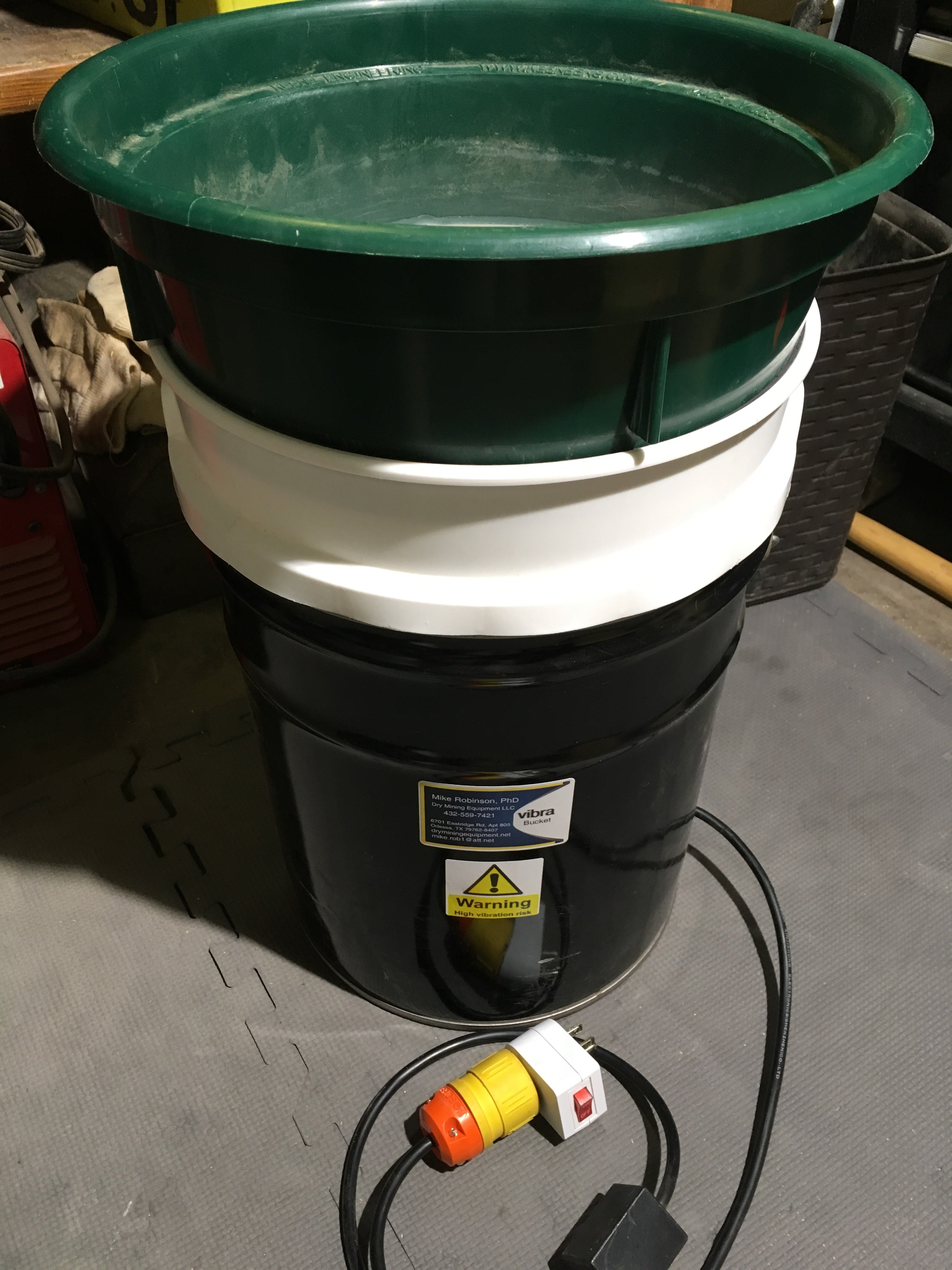 Portable Vibra Bucket vibrating shaker: reinforced 5-gal steel pail with 30W AC motor and short 3.5-gal receiver for fine-mesh screening (screens not included).