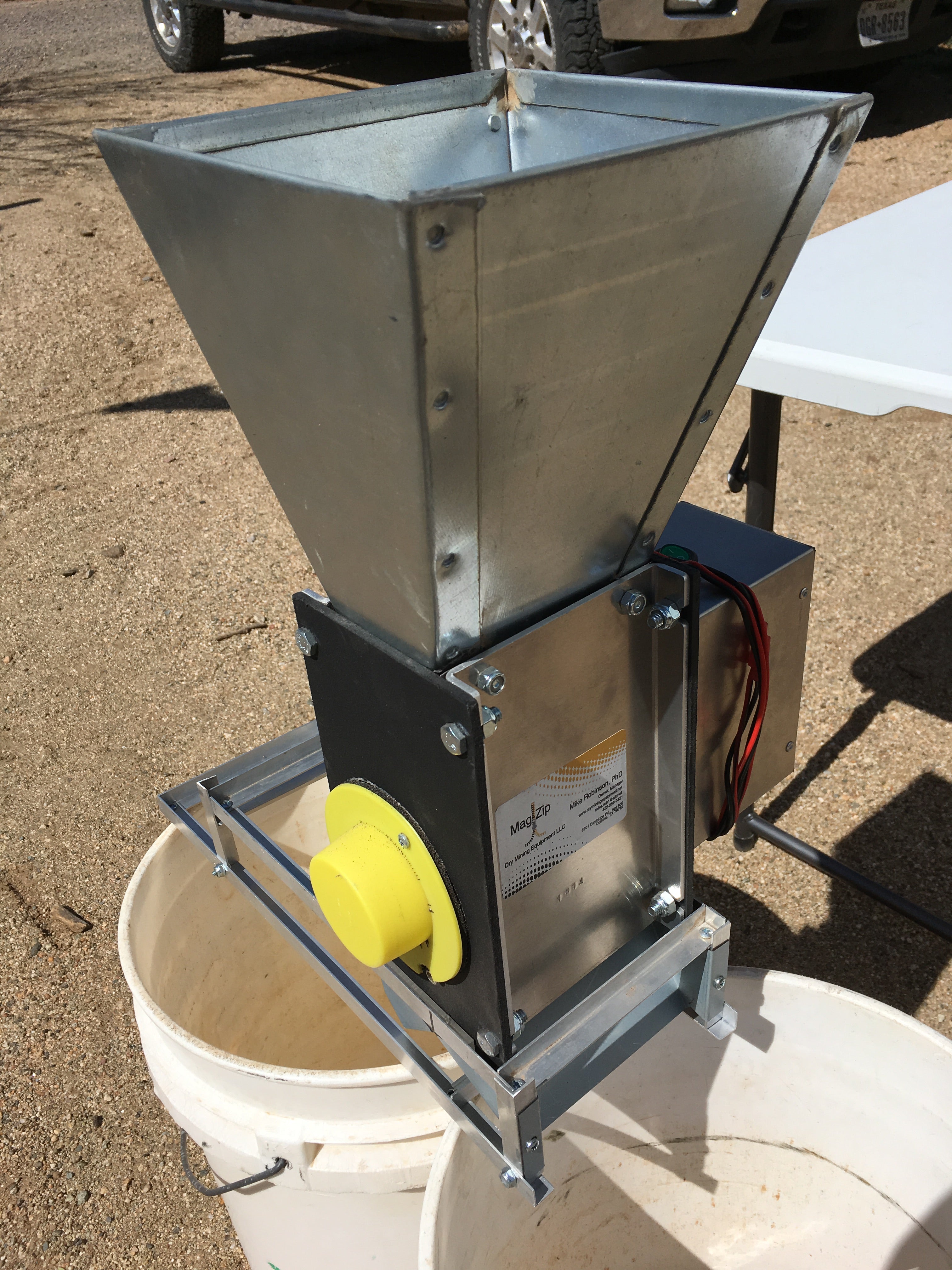MAG-ZIP dry magnetic separator for black sand concentrates, showing continuous-flow design and magnetite removal chute.